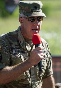 Lt. Col. Matt Lawrence, Chief of Recruiting Communications for the Office of the Chief of the Army Reserve, motivates the crowds of participants of this year's Twin Cities Tough Mudder in Hugo, MN. The Army Reserve has sponsored ten Tough Mudder events across the United States in order to bring more awareness about the Army Reserve to the community. (U.S. Army photo by Staff Sgt. Cliff Coy)