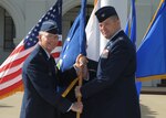 Brig. Gen. Bob LaBrutta (left), 502nd Air Base Wing and Joint Base San Antonio commander, passes the guidon to Col. Thomas Miner, incoming 502nd Security Forces and Logistics Support Group commander,
July 21 at JBSA-Randolph.
