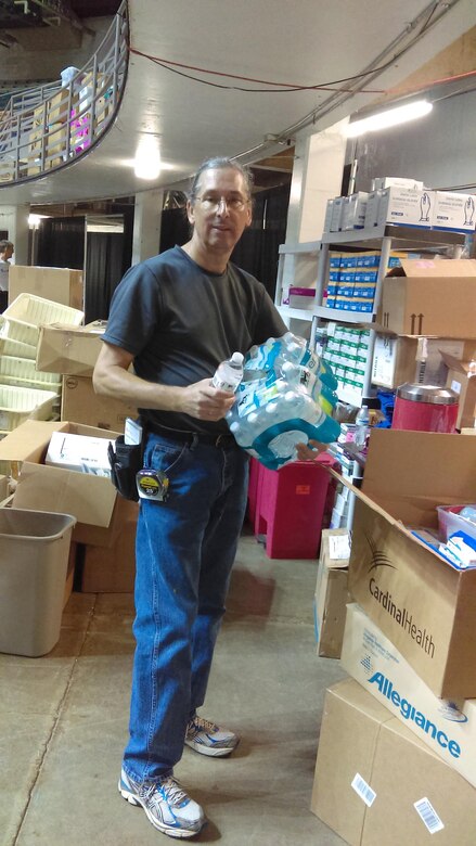William Noel oversaw the distribution of more than 8,000 bottles of water during the "Your Best Pathway to Health" event July 12-14 in Beckley, West Virginia.