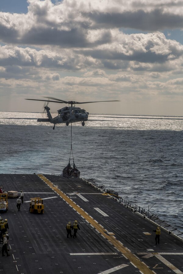 U.S. Navy Sailors with the USS Wasp and the USNS William McLean conduct replenishment at sea on March 21, 2016. 