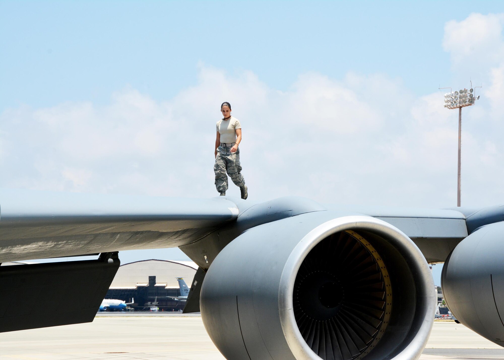 160917-EW270-084 JOINT BASE PEARL HARBOR-HICKAM (July 19, 2016) U.S. Air Force Senior Airman Nathalie Hamilton, a crew chief with the 507th Maintenance Squadron at Tinker Air Force Base, Okla., walks the along a wing of a KC-135R Stratotanker as part of a thru-flight inspection during Rim of the Pacific 2016. (U.S. Air Force photo\Tech. Sgt. Lauren Gleason)