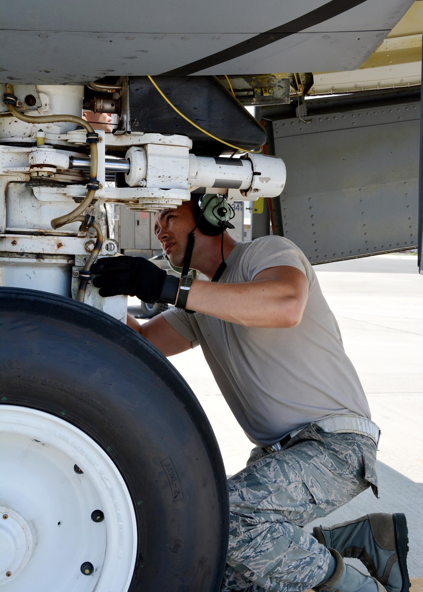 JOINT BASE PEARL HARBOR-HICKAM - Tech Sgt. Michael Dunning, crew chief with the 507th Aircraft Maintenance Squadron at Tinker Air Force Base, Okla., performs a nose landing gear inspection following an aerial refueling mission as part of Rim of the Pacific 2016. (U.S. Air Force photo\Tech. Sgt. Lauren Gleason)