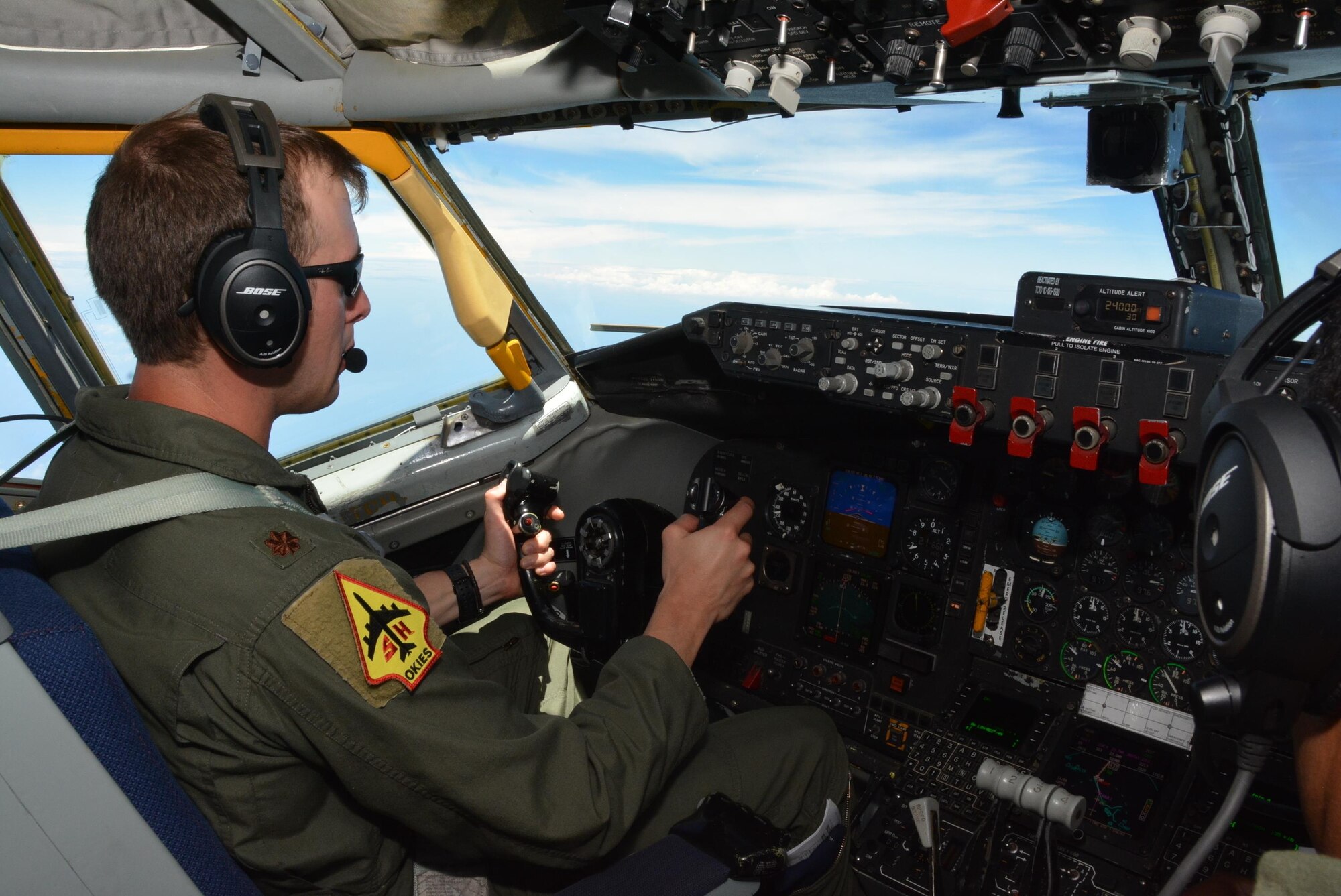 JOINT BASE PEARL HARBOR-HICKAM - U.S. Air Force Maj. Brian Doss, pilot with the 465th Air Refueling Squadron, Tinker Air Force Base, Okla., flies a KC-135R Stratotanker refueling mission over the Pacific Ocean as part of Rim of the Pacific 2016. During the flight, the team from Tinker offloaded 49,700 lbs. of fuel to six U.S. Navy F-18 Hornets and two Canadian CF-18 Hornets. (U.S. Air Force photo\Tech. Sgt. Lauren Gleason)