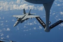 160720-F-EW270-219 JOINT BASE PEARL HARBOR-HICKAM (July 20, 2016) A U.S. Navy F-18 Hornet prepares to receive fuel from a KC-135R Stratotanker assigned to the 465th Air Refueling Squadron at Tinker Air Force Base, Okla during Rim of the Pacific 2016. (U.S. Air Force photo\Tech. Sgt. Lauren Gleason)