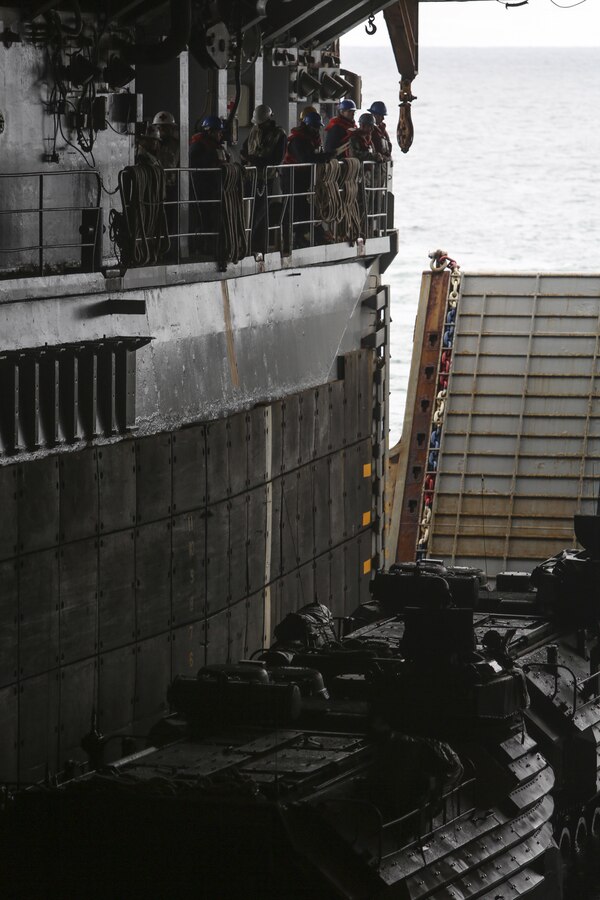 U.S. Marines with Battalion Landing Team 1/6, 22nd Marine Expeditionary Unit (MEU) depart the USS Whidbey Island (LSD 41) in assault amphibious vehicles during PHIBRON/MEU Integration Training (PMINT), March 20, 2016. PMINT was conducted as part of training required of Marines and Sailors preparing for an upcoming deployment.