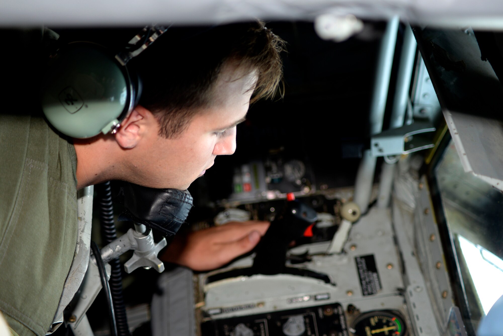 Senior Airman Taylor Manz, a boom operator assigned to the 91st Air Refueling Squadron gets in position to begin refueling an F-22 Raptor July 18, 2016. Boom Operators are trained to refuel aircraft in flight which enables rapid global mobility and gives the joint warfighter the advantage. (U.S. Air Force photo by Airman 1st Class Rito Smith)