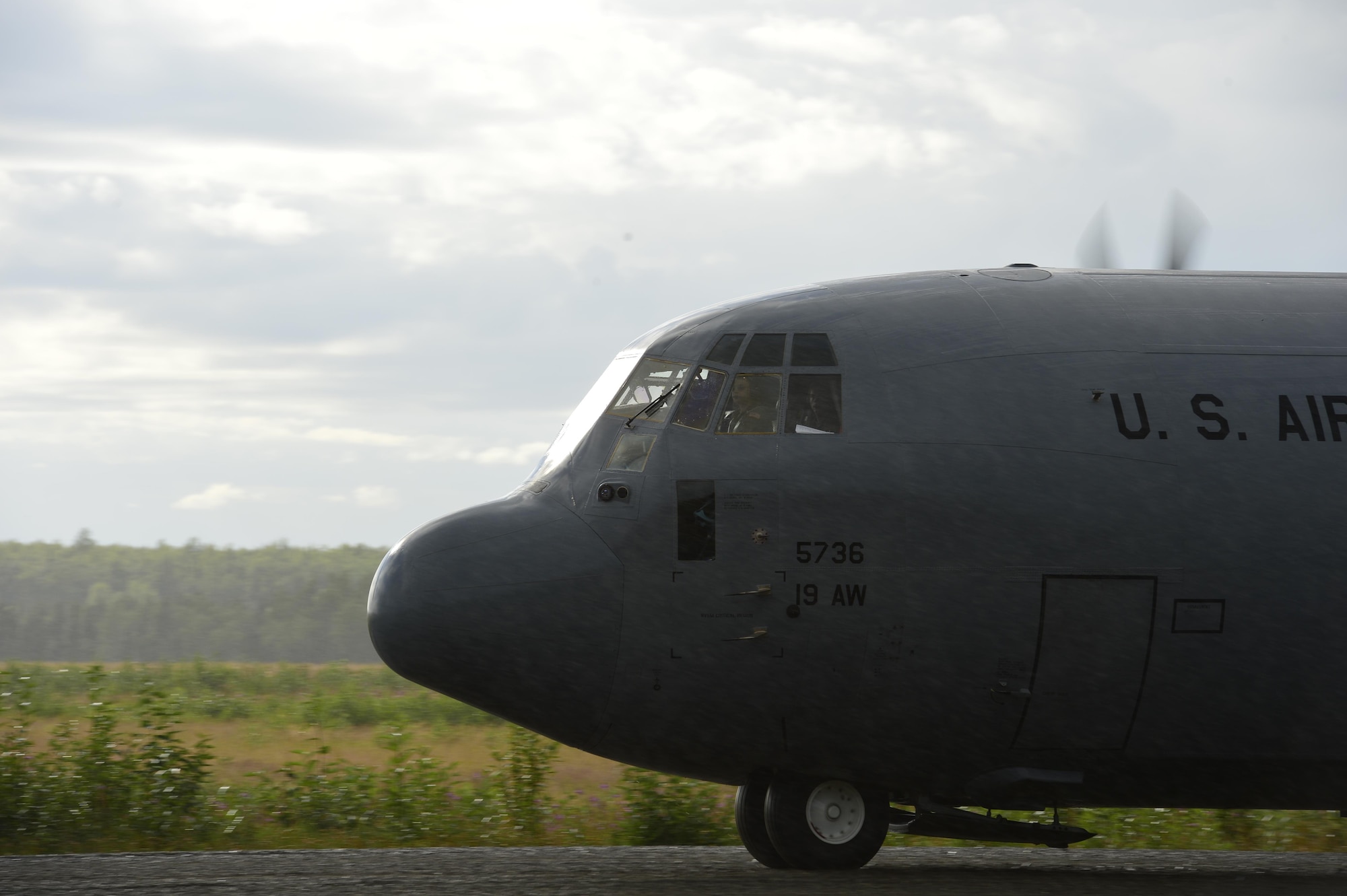 A C-130J Super Hercules lands on a gravel landing strip July 22, 2016, at Joint Base Elmendorf-Richardson, Alaska. The 41st Airlift Squadron loaded four C-130Js with approximately 100 Team Little Rock Airmen, including pilots, loadmasters, maintainers, aircrew flight equipment and intel personnel for a week of deployment training at Joint Base Elmendorf-Richardson, Alaska. (U.S. Air Force photo by Senior Airman Kaylee Clark)