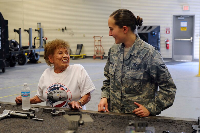 Connie Palacioz, a riveter during World War II, left, talks with Senior Airman Ciarra White, 22nd Maintenance Squadron aircraft structural maintenance journeyman, July 20, 2016, at McConnell Air Force Base, Kan. Palacioz was only 17 when she started working as a riveter at Boeing’s plant in Wichita, Kan., riveting the cockpits of B-29 Superfortresses. (U.S. Air Force photo/Airman 1st Class Jenna K. Caldwell)