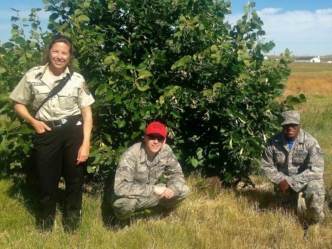 Dr. Elin Pierce, left, Senior Airman Billy Hunt, center, and Tech. Sgt. Freddie Belton, right, all assigned to the 341st Missile Wing, pose for a photo July 14, 2016, at Malmstrom Air Force Base, Mont. Malmstrom Airmen encountered a wildlife phenomenon, and through perseverance and understanding, handled what could have been a sticky situation in the most natural way possible. (Courtesy photo)