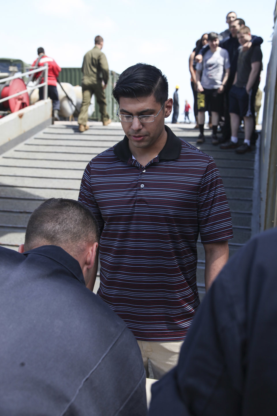 A simulated evacuee gives his information during an evacuation control center drill aboard the USS Whidbey Island (LSD 41), April 13, 2016. The Sailors conducted the exercise to simulate and validate procedures that would be used during an evacuation. 