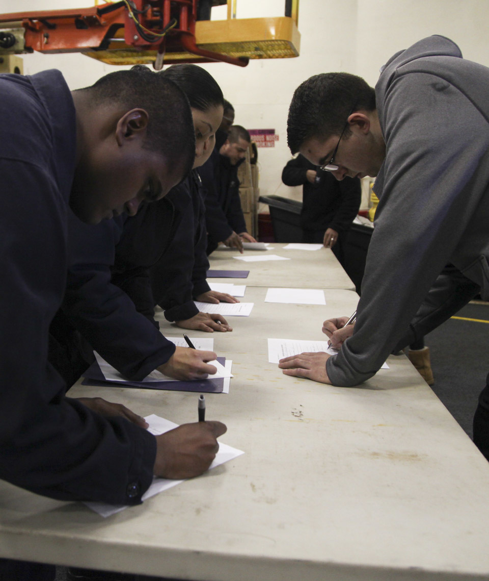 U.S. Navy sailors conduct medical screening for simulated evacuees during an evacuation control center drill aboard the USS Whidbey Island (LSD 41), April 13, 2016. The Sailors conducted the exercise to simulate and validate procedures that would be used during an evacuation. 