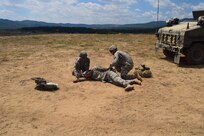 Cpl. Alexandra Jordan, a medic with the 766th Engineer Company (Horizontal), 841st Engineer Battalion, U.S. Army Reserve, and Spc. Jorge A. Arcineigas, a medic with the Headquarters and Headquarters Company, 841st Eng. Bn., respond to a simulated casualty during a casualty evacuation drill at Novo Selo Training Area, Bulgaria as part of Operation Resolute Castle 16, July 23, 2016. The drill was designed to validate procedures and protocol for both the battalion staff and personnel in the field. (U.S. Army photo by Capt. Jose F. Lopez Jr., 841st Eng. Bn., United States Army Reserve)