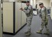 Tech. Sgt. Richard Lape and Staff Sgt. Marcus Weisbarth search the building for threats after neutralizing an active shooter in a training exercise here, July 26, 2016. The base-wide exercise involved an active shooter opening fire in the supply building using blank rounds shot from an M-4 training rifle. All base buildings were locked down and some work centers were evacuated while Wing Inspection Team members evaluated. The scenario was designed to test responses from building managers and occupants and installation security forces. (U.S. Air Force photo/Eric White)
