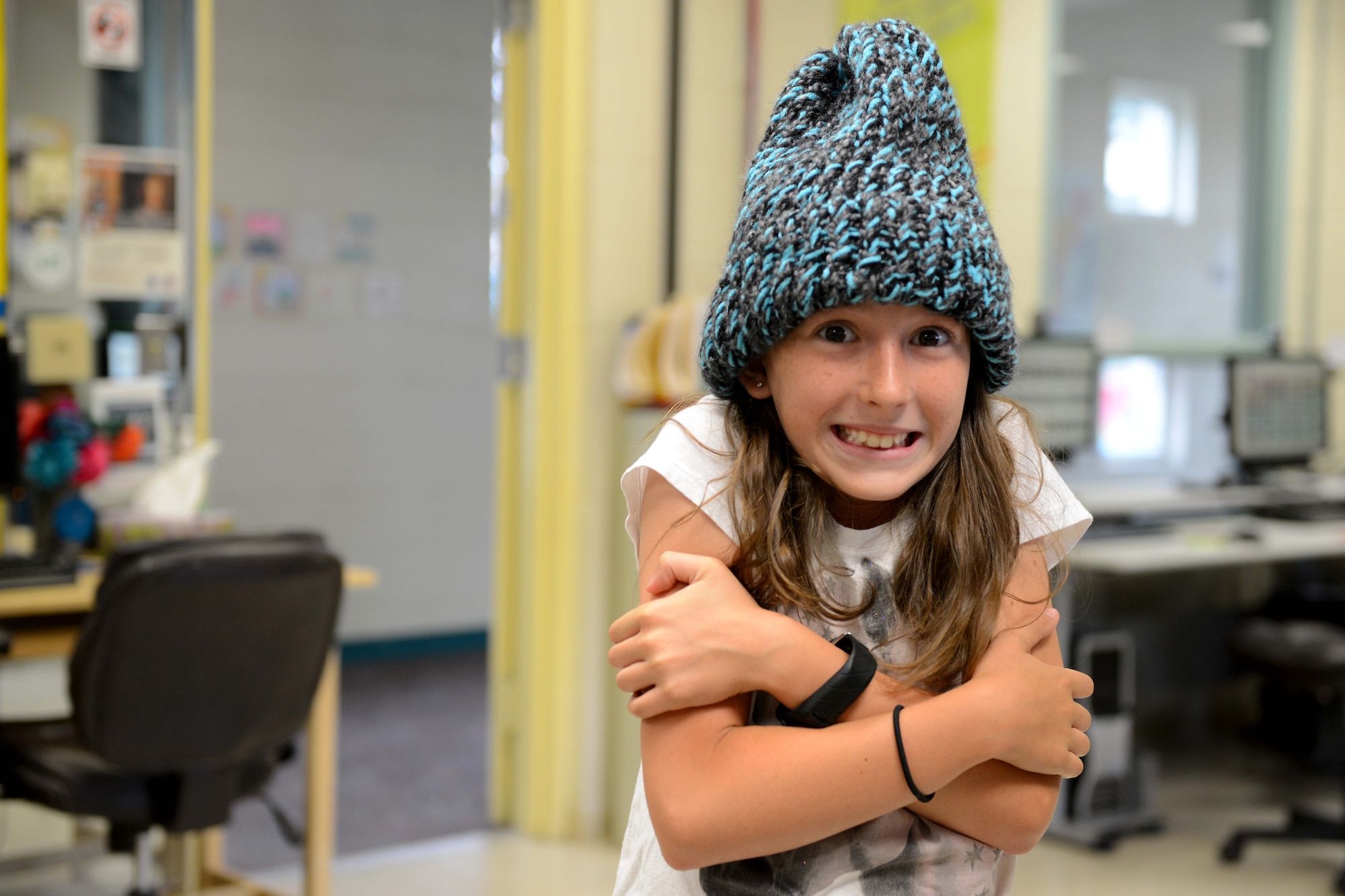 Elizabeth Lewis, 10, sports a cap sewn by a sewing camp participant at the Two Rivers Youth Center at Joint Base Elmendorf-Richardson, Alaska, July 21, 2016. Sewing camp is offered every summer at Two Rivers. (U.S. Air Force photo by Airman 1st Class Javier Alvarez)