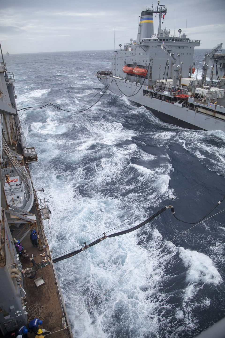 USNS Big Horn (T-AO-198), a fleet replenishment oiler, conducts a double underway replenishment as part of an alongside connected replenishment (CONREP), April 14, 2016. The CONREP was conducted to replenish fuel for the USS Whidbey Island (LSD-41) and USS WASP (LHD-1). 