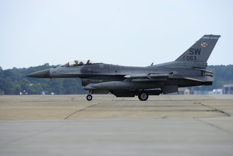 A U.S. Air Force F-16CM Fighting Falcon taxis on the flight line at Langley Air Force Base, Va., following a 95th Anniversary Maj. Gen. William “Billy” Mitchell memorial reenactment, July 22, 2016. The reenactment memorialized the 1921 airpower trials at Langley Field led by Mitchell, an early aviation visionary and outspoken advocate of American air power. (U.S. Air Force photo by Staff Sgt. R. Alex Durbin)