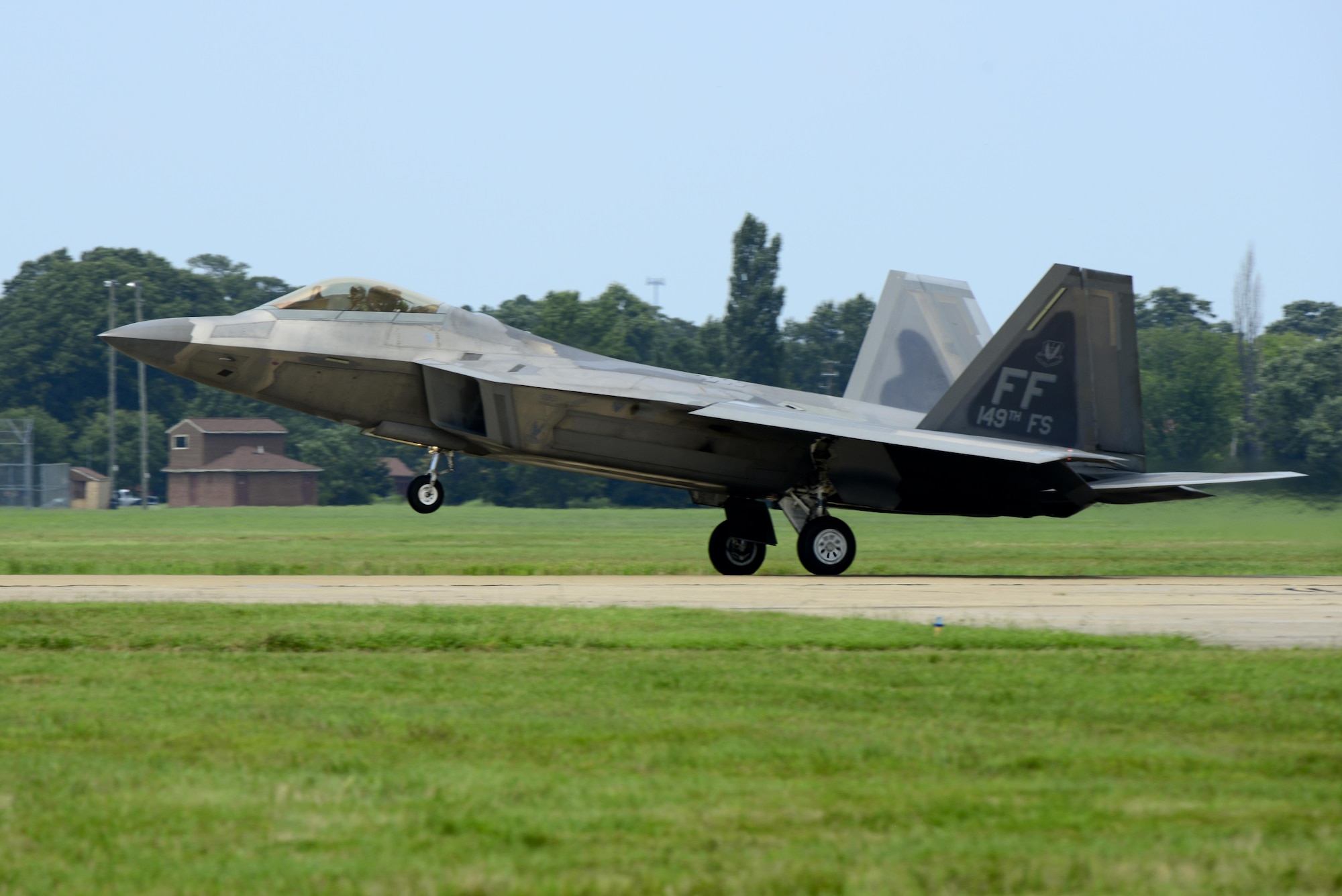 A U.S. Air Force F-22 Raptor lands at Langley Air Force Base, Va., following a 95th Anniversary Maj. Gen. William “Billy” Mitchell memorial reenactment, July 22, 2016. Each year, Air Force Airmen honor Mitchell, a U.S. Army general regarded as the father of the Air Force. (U.S. Air Force photo by Staff Sgt. R. Alex Durbin)