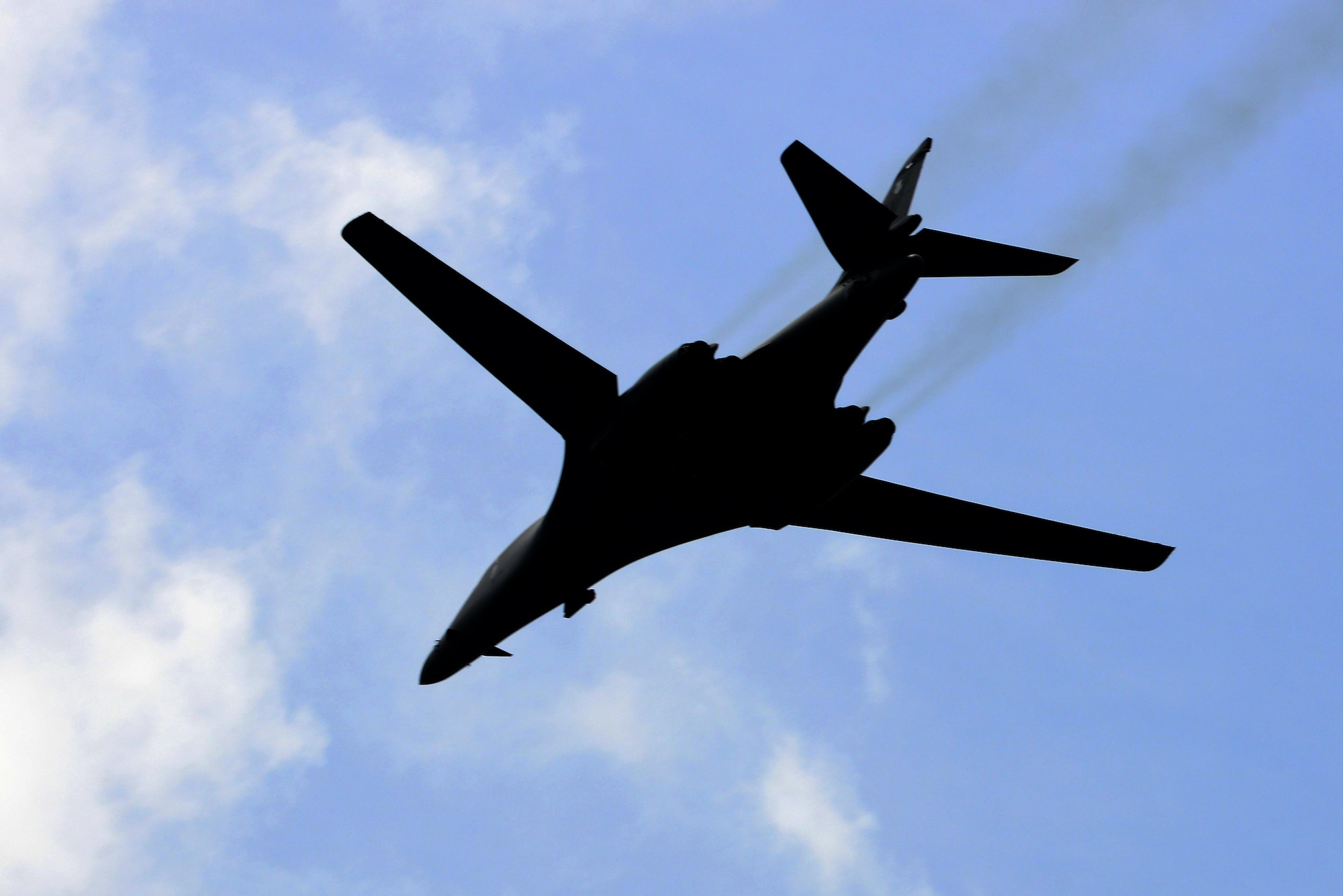 A B-1 Lancer flies over Langley Air Force Base, Va., following a 95th Anniversary Maj. Gen. William “Billy” Mitchell memorial reenactment, July 22, 2016. Pilots flying 8 different airframes dropped more than 30 inert munitions to memorialize the bombing of the Ostfriesland, an “unsinkable” captured German battleship, during the 1921 airpower trials – an accomplishment which proved aviation’s place in the U.S. military. (U.S. Air Force photo by Staff Sgt. R. Alex Durbin)