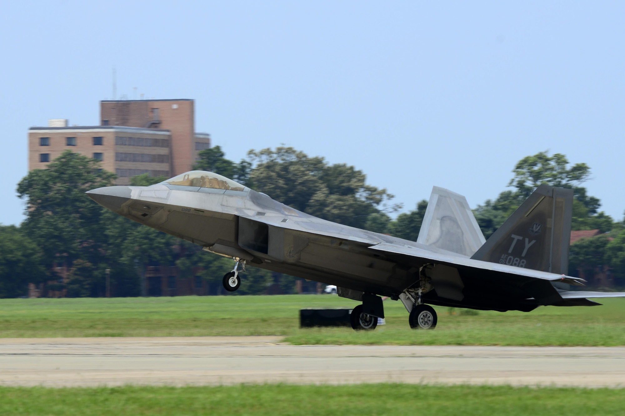 A U.S. Air Force F-22 Raptor lands at Langley Air Force Base, Va., following a 95th Anniversary Maj. Gen. William “Billy” Mitchell memorial reenactment, July 22, 2016. Each year, Air Force Airmen honor Mitchell, a U.S. Army general regarded as the father of the Air Force. (U.S. Air Force photo by Staff Sgt. R. Alex Durbin)
