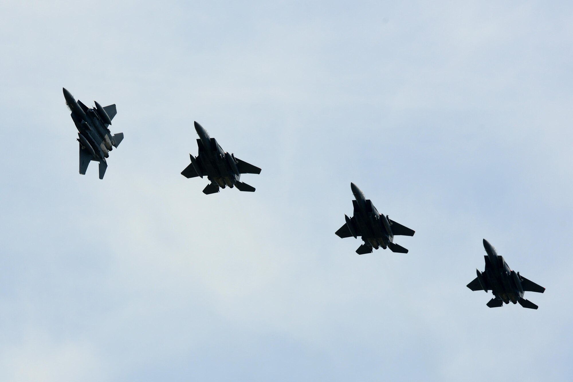 A group of U.S. Air Force F-15 Strike Eagles prepare to land at Langley Air Force Base, Va., following a 95th Anniversary Maj. Gen. William “Billy” Mitchell memorial reenactment, July 22, 2016. Pilots flying 8 different airframes dropped inert munitions at the original site of the 1921 airpower trials of the coast of the Virginian Capes, where the sunken Ostfriesland still lies. (U.S. Air Force photo by Staff Sgt. R. Alex Durbin)