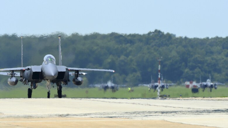 A U.S. Air Force F-15 Strike Eagle taxis on the flight line at Langley Air Force, Va., following a 95th Anniversary Maj. Gen. William “Billy” Mitchell memorial reenactment, July 22, 2016. In honor of Mitchell, pilots from across the Air Force gathered to reenact Mitchell’s airpower trials which demonstrated aviation’s place in the U.S. military on July 21, 1921. (U.S. Air Force photo by Staff Sgt. R. Alex Durbin)