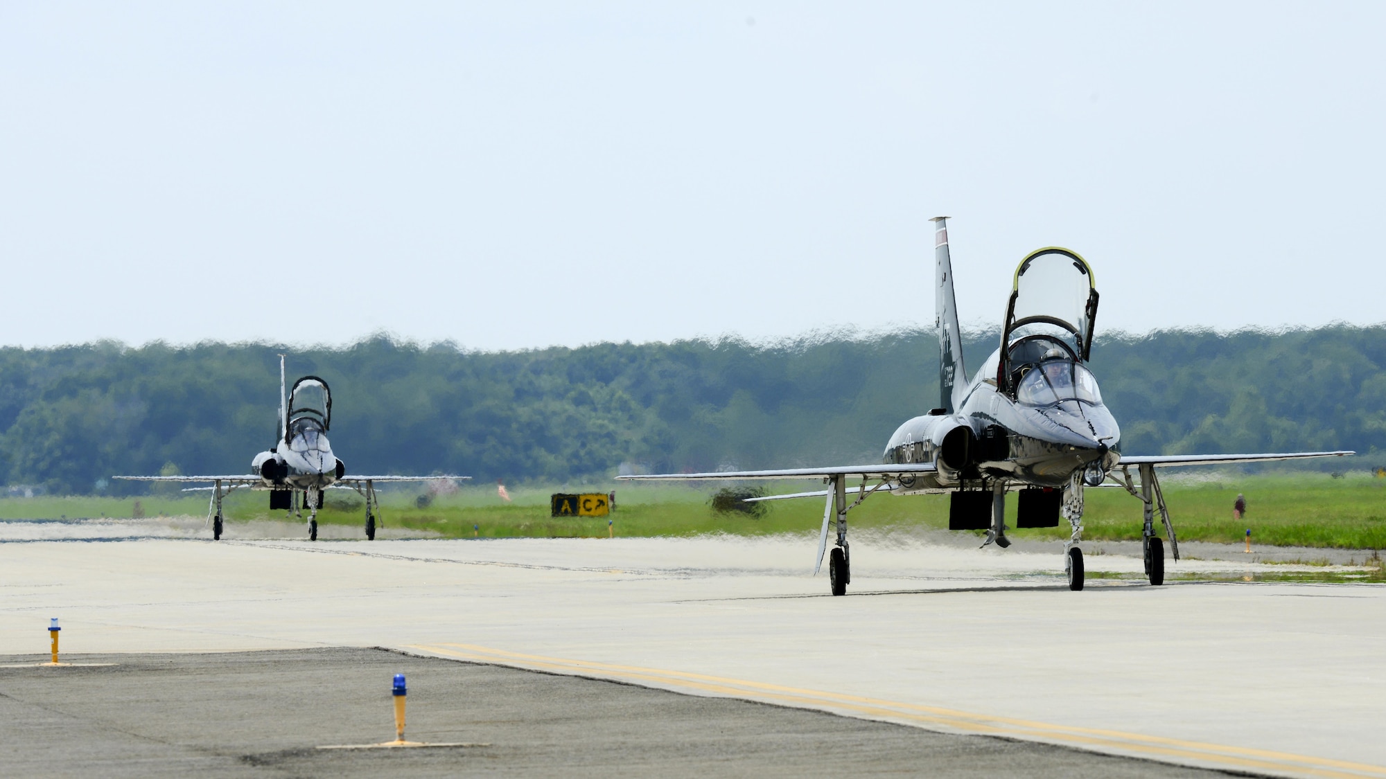 Two U.S. Air Force T-38 Talons taxi on the flight line at Langley Air Force Base, Va., following a 95th Anniversary Maj. Gen. William “Billy” Mitchell memorial reenactment, July 22, 2016. Seven fighter wings, eight airframes and 33 aircrews from across the Air Force gathered to celebrate the 95th anniversary of the 1921 airpower trials. (U.S. Air Force photo by Staff Sgt. R. Alex Durbin)