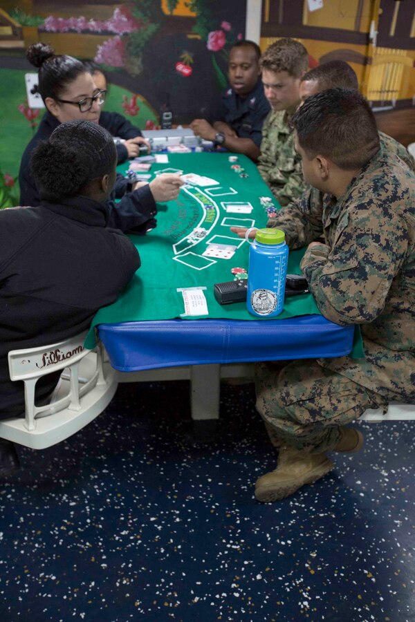 Marines and Sailors aboard the USS San Antonio (LPD-17) enjoyed a night of blackjack, poker and spades April 10, 2016. The servicemembers, from the 22nd Marine Expeditionary Unit and Amphibious Squadron Six (PHIBRON-6), are underway for Amphibious Ready Group/MEU exercises. 