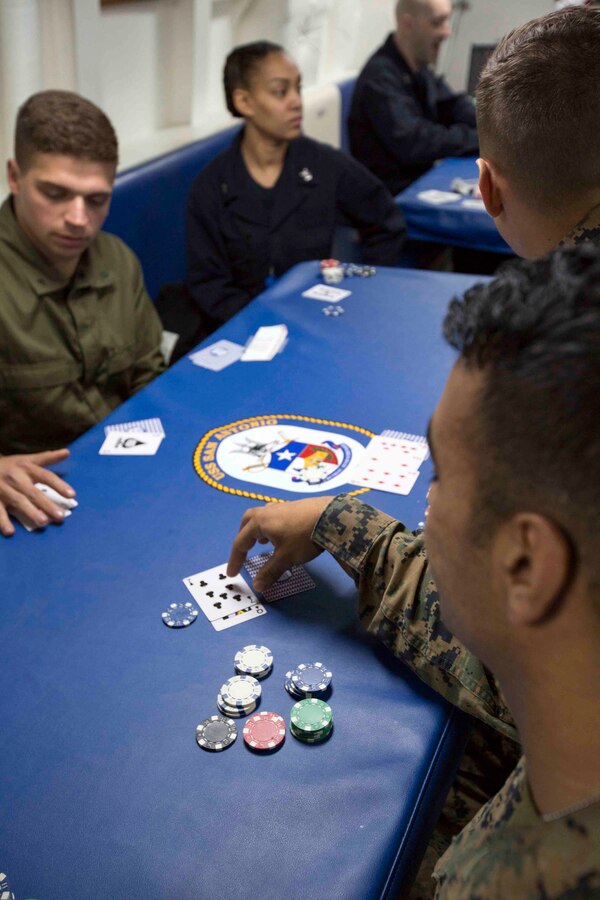 Marines and Sailors aboard the USS San Antonio (LPD-17) enjoyed a night of blackjack, poker and spades April 10, 2016. The servicemembers, from the 22nd Marine Expeditionary Unit and Amphibious Squadron Six (PHIBRON-6), are underway for Amphibious Ready Group/MEU exercises. 