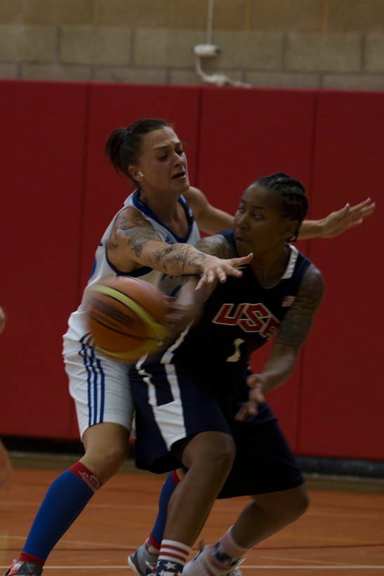 U.S. Army Sgt. Danielle Deberry, a guard on the United States Military Women’s Basketball Team, passes to a teammate during the United States vs. France game at the Conseil International Du Sport Militaire (CISM) World Military Women’s Basketball Championship July 26 at Camp Pendleton, California. The United States’ team defeated France 85 to 53.  The base is hosting the CISM World Military Women’s Basketball Championship July 25 through July 29 to promote peace activities and solidarity among military athletes through sports. (U.S. Marine Corps photo by Sgt. Abbey Perria)