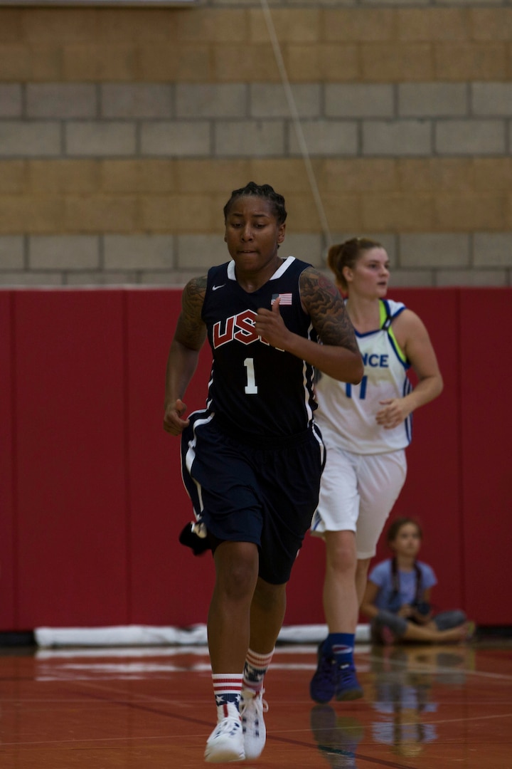 U.S. Army Sgt. Danielle Deberry, a guard on the United States Military Women’s Basketball Team, hustles down the court during the United States vs. France game at the Conseil International Du Sport Militaire (CISM) World Military Women’s Basketball Championship July 26 at Camp Pendleton, California. The base is hosting the CISM World Military Women’s Basketball Championship July 25 through July 29 to promote peace activities and solidarity among military athletes through sports. (U.S. Marine Corps photo by Sgt. Abbey Perria)