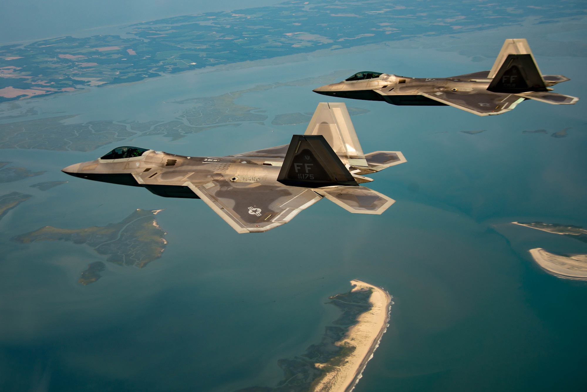 F-22A Raptors return to Langley Air Force Base after dropping Joint Direct Attack Munitions during the 95th anniversary of Maj. Gen. William “Billy” Mitchell bombing the Ostfriesland at Langley Air Force Base, Va., July 22, 2016. Seven fighter wings, eight different airframes and 33 aircrews Air Force-wide supported the two-day event by taking off from, Langley
AFB, and flying the same path the 1st Provisional Air Brigade flew and drop
inert bombs where the sunken, Ostfriesland lies. (U.S. Air Force photo by Staff Sgt. J.D. Strong II)