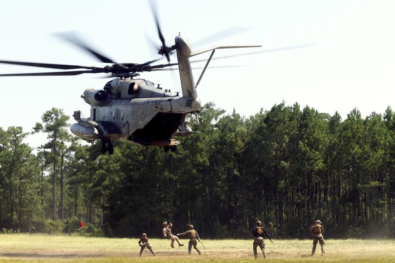 Marines with U.S. Marine Corps Forces Special Operations Command complete a fast rope and rappelling course on Landing Zone Parrot at Marine Corps Base Camp Lejeune, N.C., July 20, 2016. The exercise was a part of a two weeklong Helicopter Insertion and Extraction Techniques Course. The CH-53 provided for the training evolution was assigned to Marine Heavy Helicopter Squadron 461, 2nd Marine Aircraft Wing. (U.S. Marine Corps photo by Lance Cpl. Mackenzie Gibson/Released)