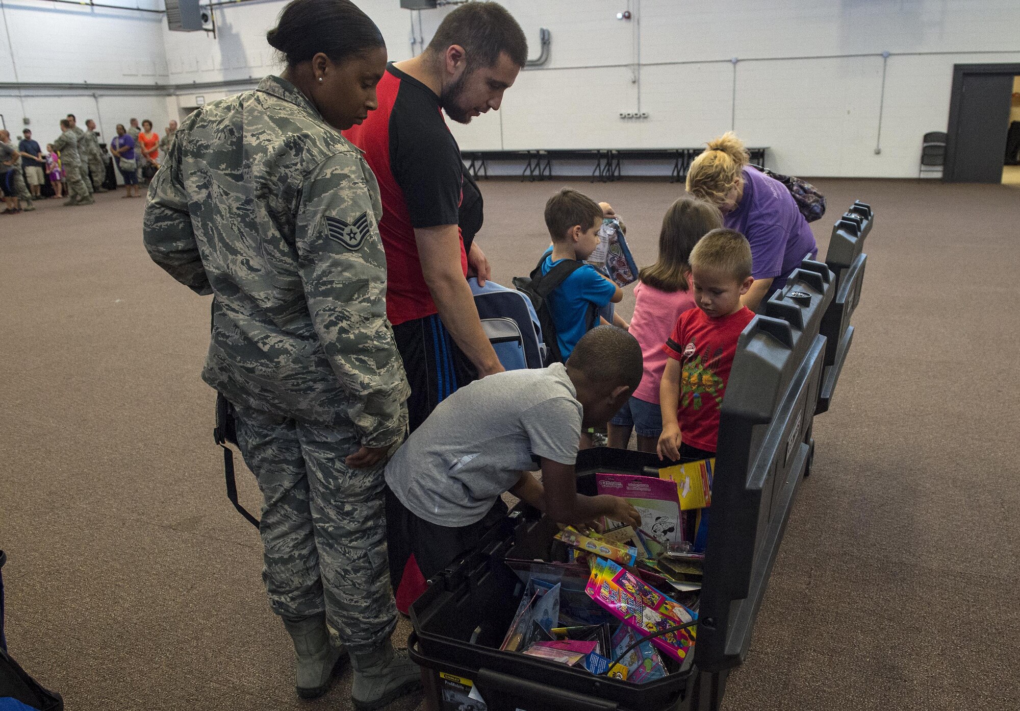 Children choose a toy during the Back to School Brigade, July 27, 2016, at Moody Air Force Base, Ga. The local community donated toys in addition to school supplies. (U.S. Air Force photo by Airman 1st Class Janiqua P. Robinson)