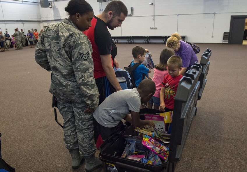 Children choose a toy during the Back to School Brigade, July 27, 2016, at Moody Air Force Base, Ga. The local community donated toys in addition to school supplies. (U.S. Air Force photo by Airman 1st Class Janiqua P. Robinson)