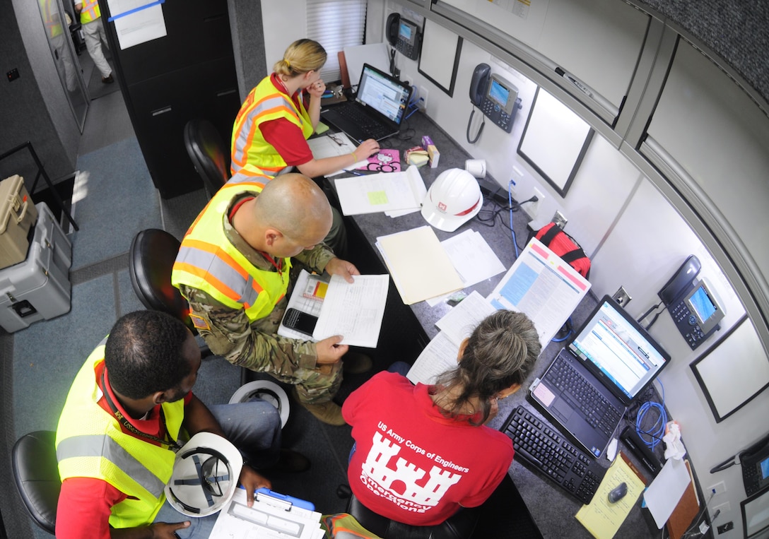 A temporary emergency power team tracks critical facilities awaiting assessments during a regional power mission exercise conducted July 20 at the Federal Emergency Management Agency Distribution Center in Atlanta, Georgia. The team replicated a temporary emergency power deployment in response to a simulated natural disaster. The three-day training and exercise tested the team's ability to execute temporary emergency power operations.