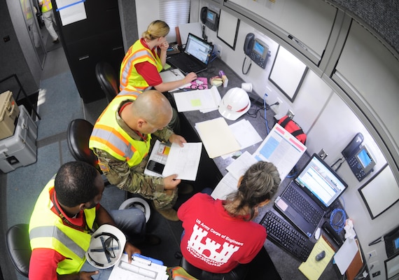 A temporary emergency power team tracks critical facilities awaiting assessments during a regional power mission exercise conducted July 20 at the Federal Emergency Management Agency Distribution Center in Atlanta, Georgia. The team replicated a temporary emergency power deployment in response to a simulated natural disaster. The three-day training and exercise tested the team's ability to execute temporary emergency power operations.