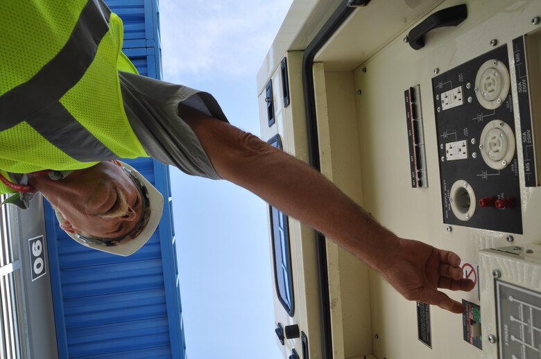 A contractor checks systems on a generator awaiting installation during a regional power mission exercise conducted July 20 at the Federal Emergency Management Agency Distribution Center in Atlanta, Georgia.