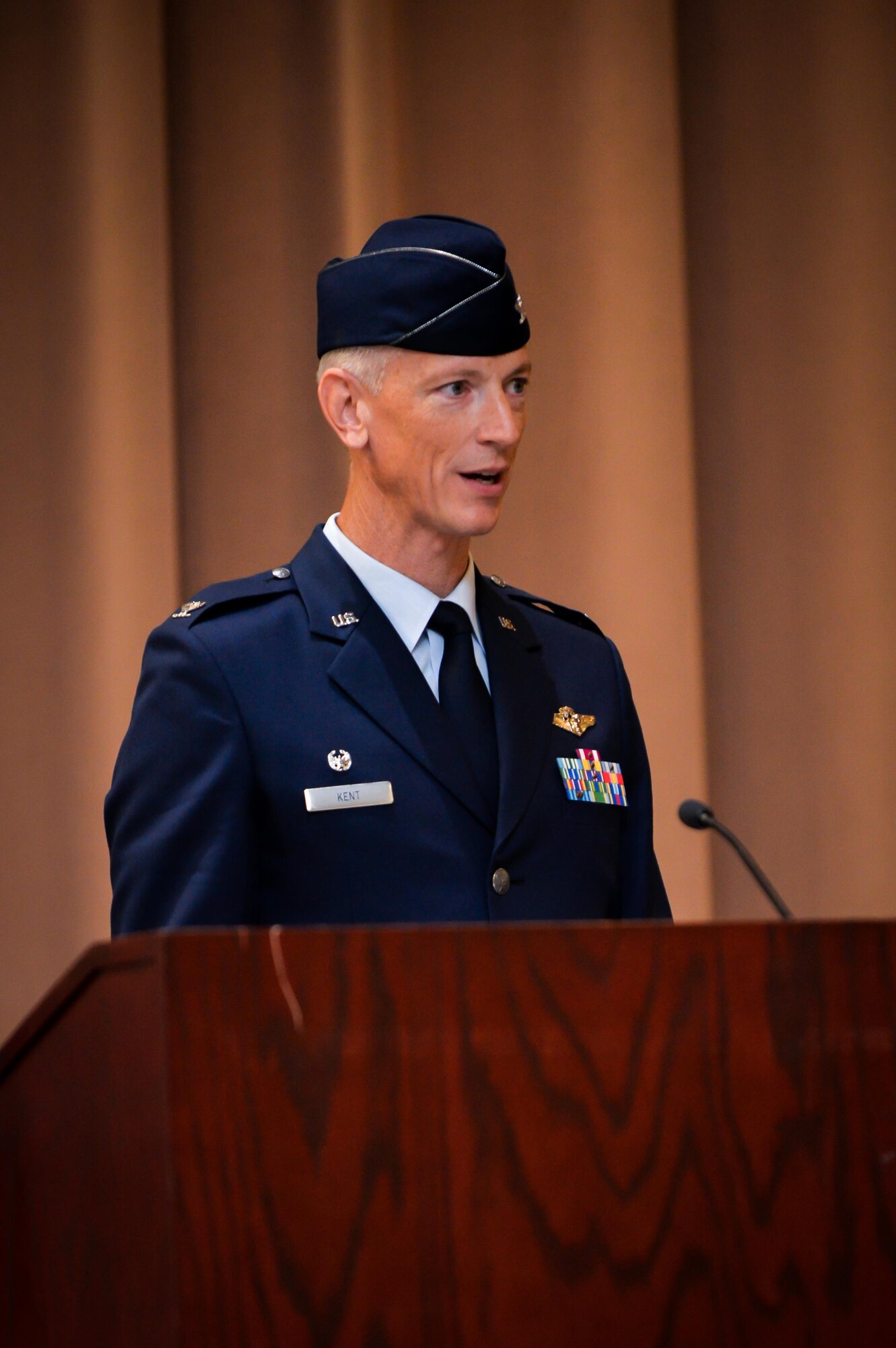 Col. Robert Kent, 2nd Medical Group commander, addresses members of the 2nd MDG for the first time during a change of command ceremony at Barksdale Air Force Base, La., July 22, 2016. Col. Robert Kent, the incoming commander commissioned in the Air Force as a physician in 1996 after graduating with a bachelor of science in chemistry from Angelo State University, San Angelo, Texas. (U.S. Air Force photo/Senior Airman Mozer O. Da Cunha)