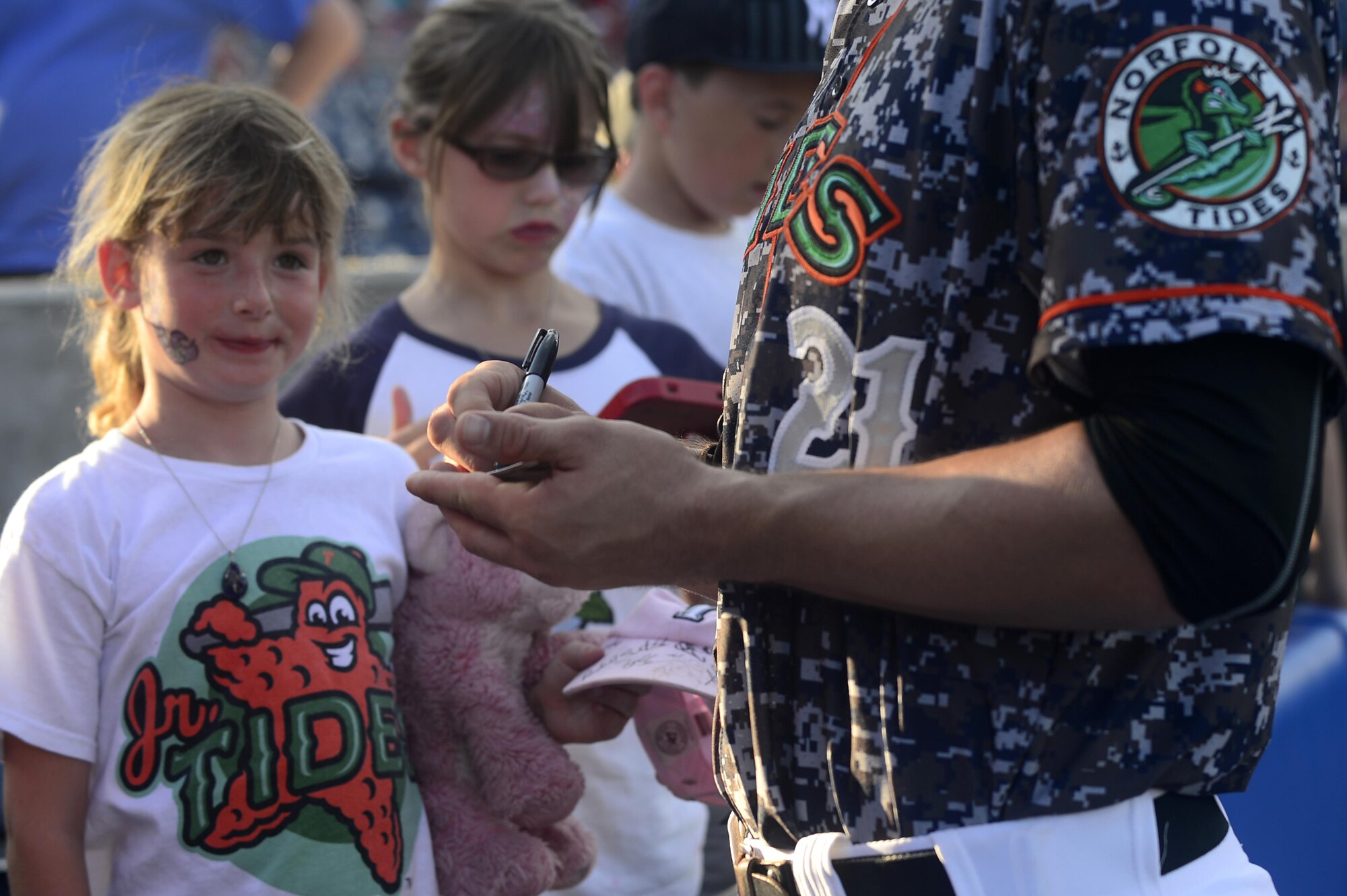 Trey Mancini, Norfolk Tides first baseman, signs autographs for children before the start of the Norfolk Tides Air Force Appreciation Night baseball game in Norfolk, Va., July 23, 2016. Fans were provided a chance to take pictures, receive autographs and meet the players before the start of the game. (U.S. Air Force photo by Airman 1st Class Kaylee Dubois)