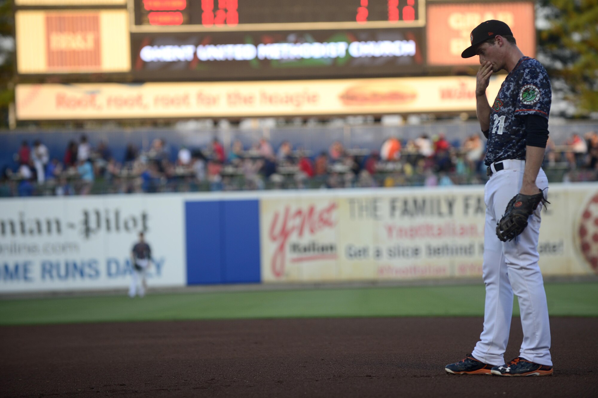 Trey Mancini, Norfolk Tides first baseman, waits for the Norfolk Tides Air Force Appreciation Night baseball game to begin in Norfolk, Va., July 23, 2016. The Tides wore digital camouflage print uniforms during the game against the Toledo Mud Hens to honor service members from all branches of the U.S. Armed Forces. (U.S. Air Force photo by Airman 1st Class Kaylee Dubois)