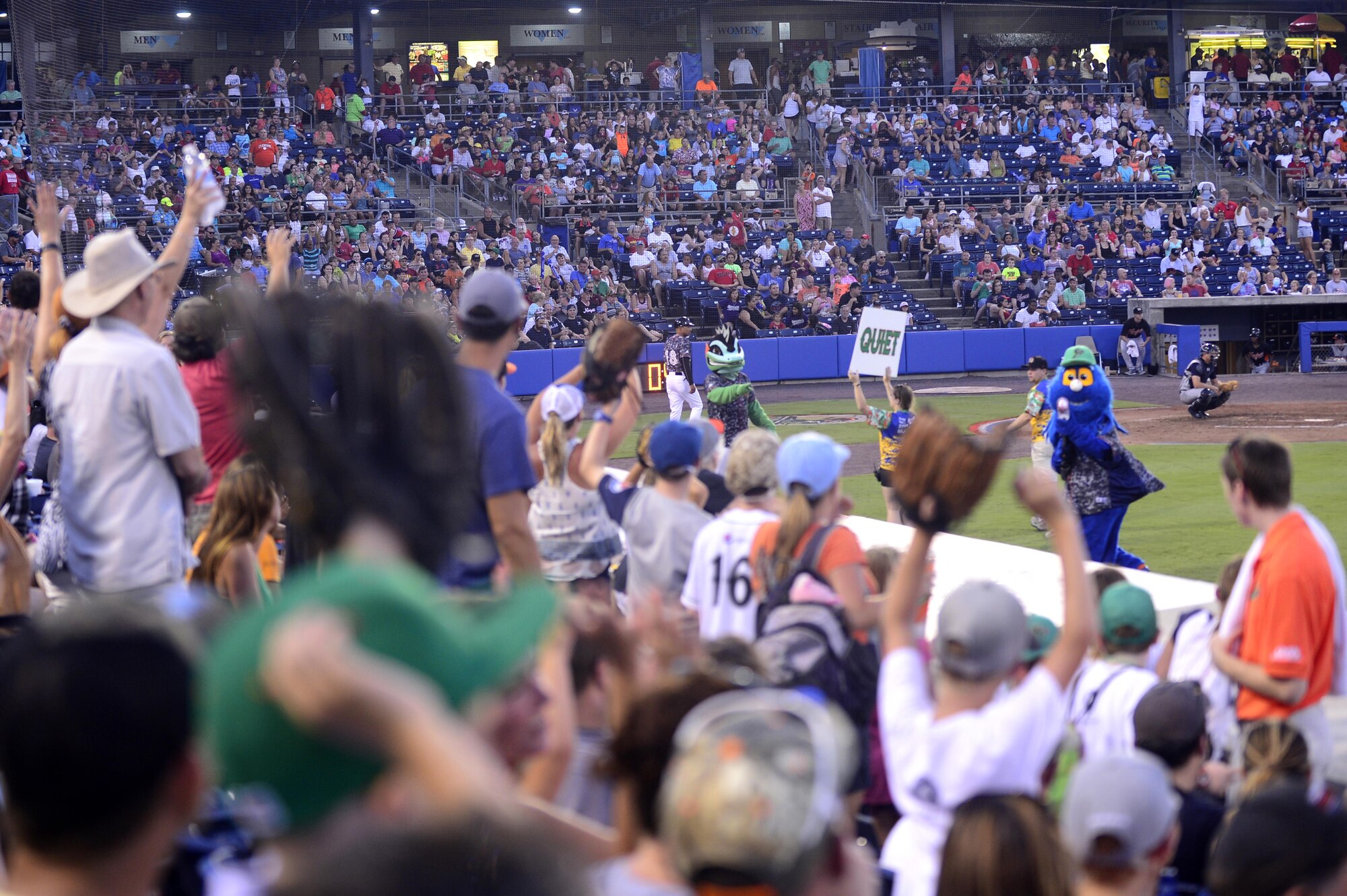 Rip Tide, Norfolk Tides mascot, shoots foam baseballs to the crowd during the Norfolk Tides Air Force Appreciation Night baseball game in Norfolk, Va., July 23, 2016. Fans participated in games between innings with the mascots and were provided with Tides memorabilia. (U.S. Air Force photo by Airman 1st Class Kaylee Dubois)