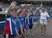 Norfolk Bulldogs Little League baseball team players participate in a meet-and-greet with players from the Norfolk Tides minor league baseball team at the Norfolk Tides Air Force Appreciation Night baseball game in Norfolk, Va., July 23, 2016. Each member of the Bulldogs teamed-up with a Tides player on the field at their respective positions for the opening remarks. (U.S. Air Force photo by Airman 1st Class Kaylee Dubois)