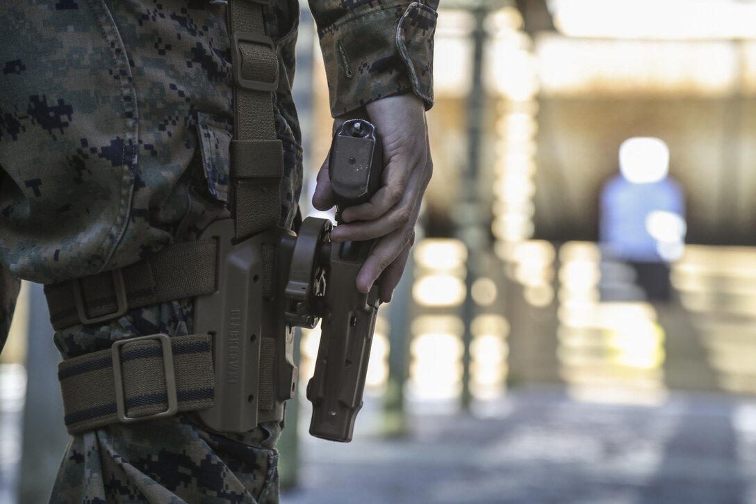 A U.S. Marine assigned to the Female Engagement Team, 22nd Marine Expeditionary Unit (MEU), participate in a pistol qualification course at Camp Lejeune, N.C., April 26, 2016. Marines with the 22nd MEU participated in a course of fire for pistol qualification in order to improve and maintain combat readiness. 