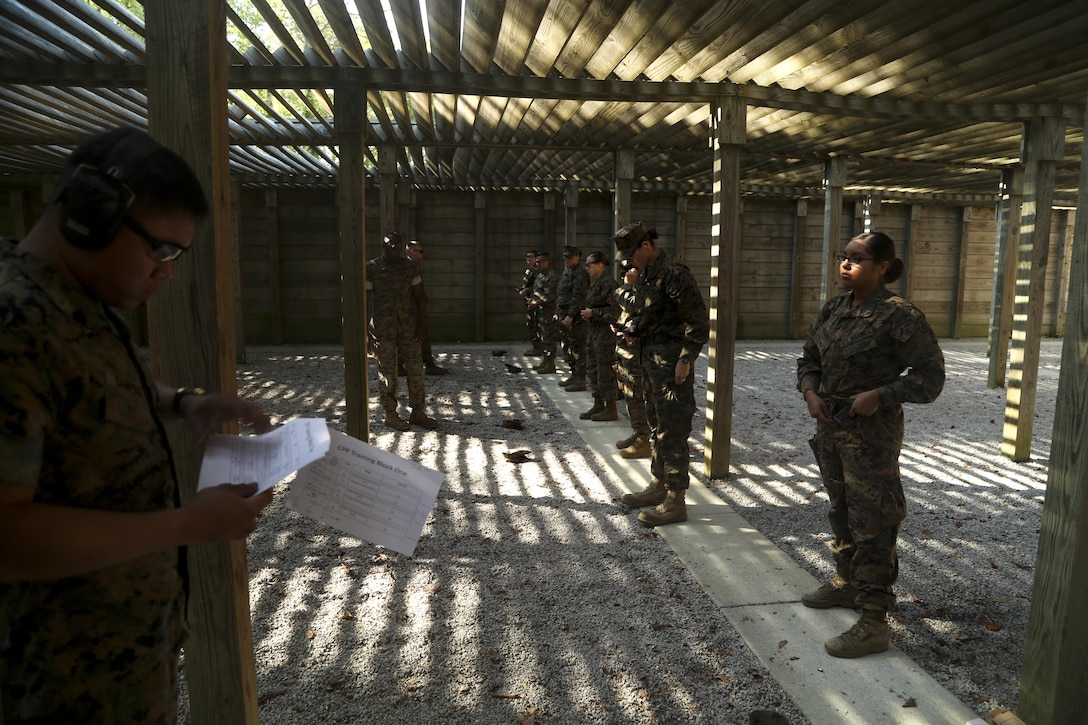 U.S. Marines assigned to the Female Engagement Team, 22nd Marine Expeditionary Unit (MEU), participate in a pistol qualification course at Camp Lejeune, N.C., April 26, 2016. Marines with the 22nd MEU participated in a course of fire for pistol qualification in order to improve and maintain combat readiness. (U.S. Marine Corps photo by Lance Cpl. Koby I. Saunders/ 22nd Marine Expeditionary Unit/ Released)