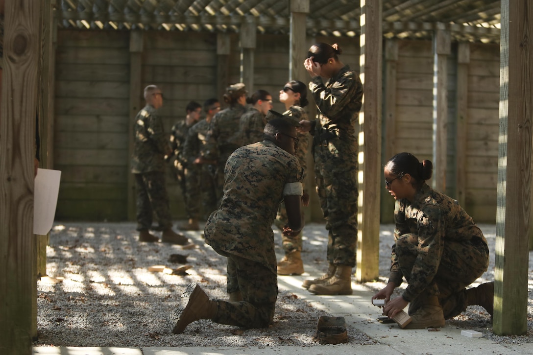 U.S. Marines assigned to the Female Engagement Team, 22nd Marine Expeditionary Unit (MEU), load ammo in a magazine during a pistol qualification course at Camp Lejeune, N.C., April 26, 2016. Marines with the 22nd MEU participated in a course of fire for pistol qualification in order to improve and maintain combat readiness. 