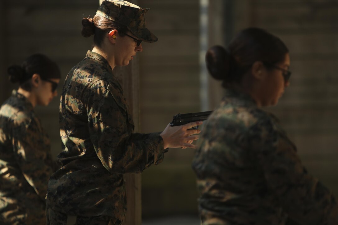 U.S. Marine Corps 1st Lt. Jessica R. Giusti, assistant officer in charge of the Female Engagement Team, 22nd Marine Expeditionary Unit (MEU), loads an m9 pistol during a qualification course at Camp Lejeune, N.C., April 26, 2016. Marines with the 22nd MEU participated in a course of fire for pistol qualification in order to improve and maintain combat readiness. 
