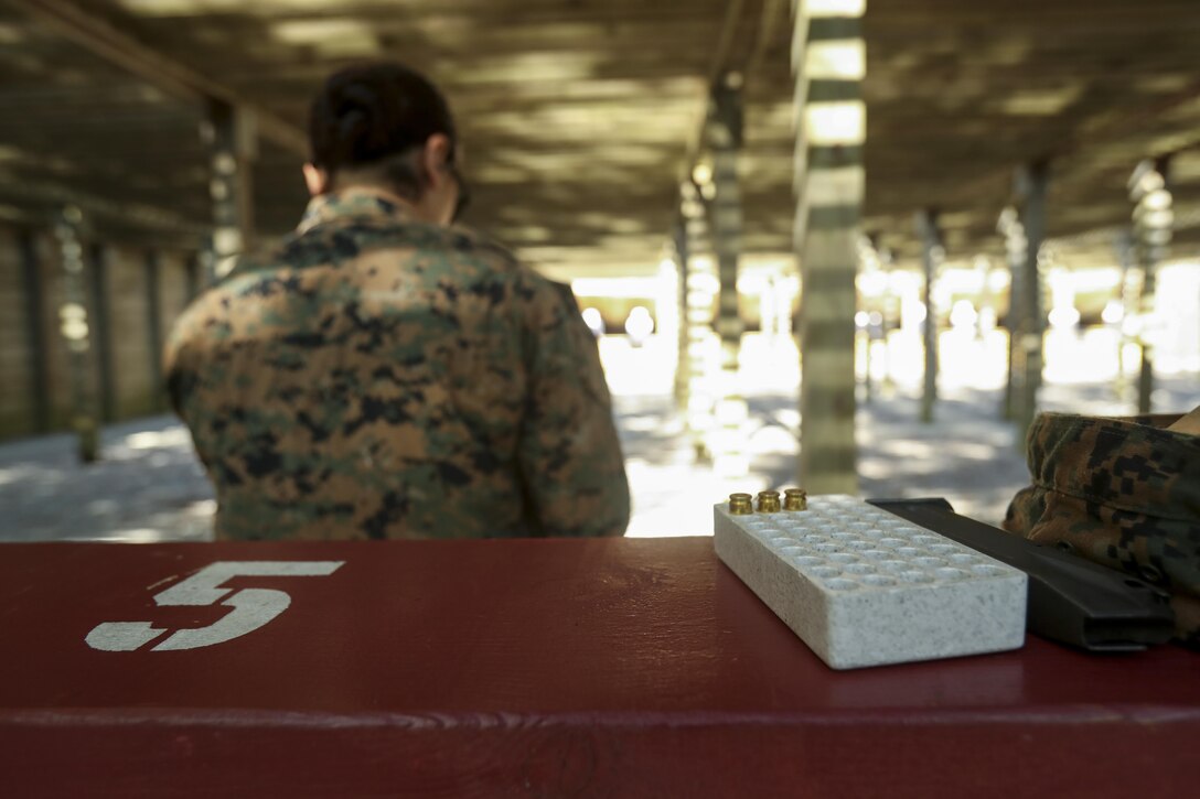 A U.S. Marine assigned to the Female Engagement Team, 22nd Marine Expeditionary Unit (MEU), participates in a pistol qualification course at Camp Lejeune, N.C., April 26, 2016. Marines with the 22nd MEU participated in a course of fire for pistol qualification in order to improve and maintain combat readiness. 