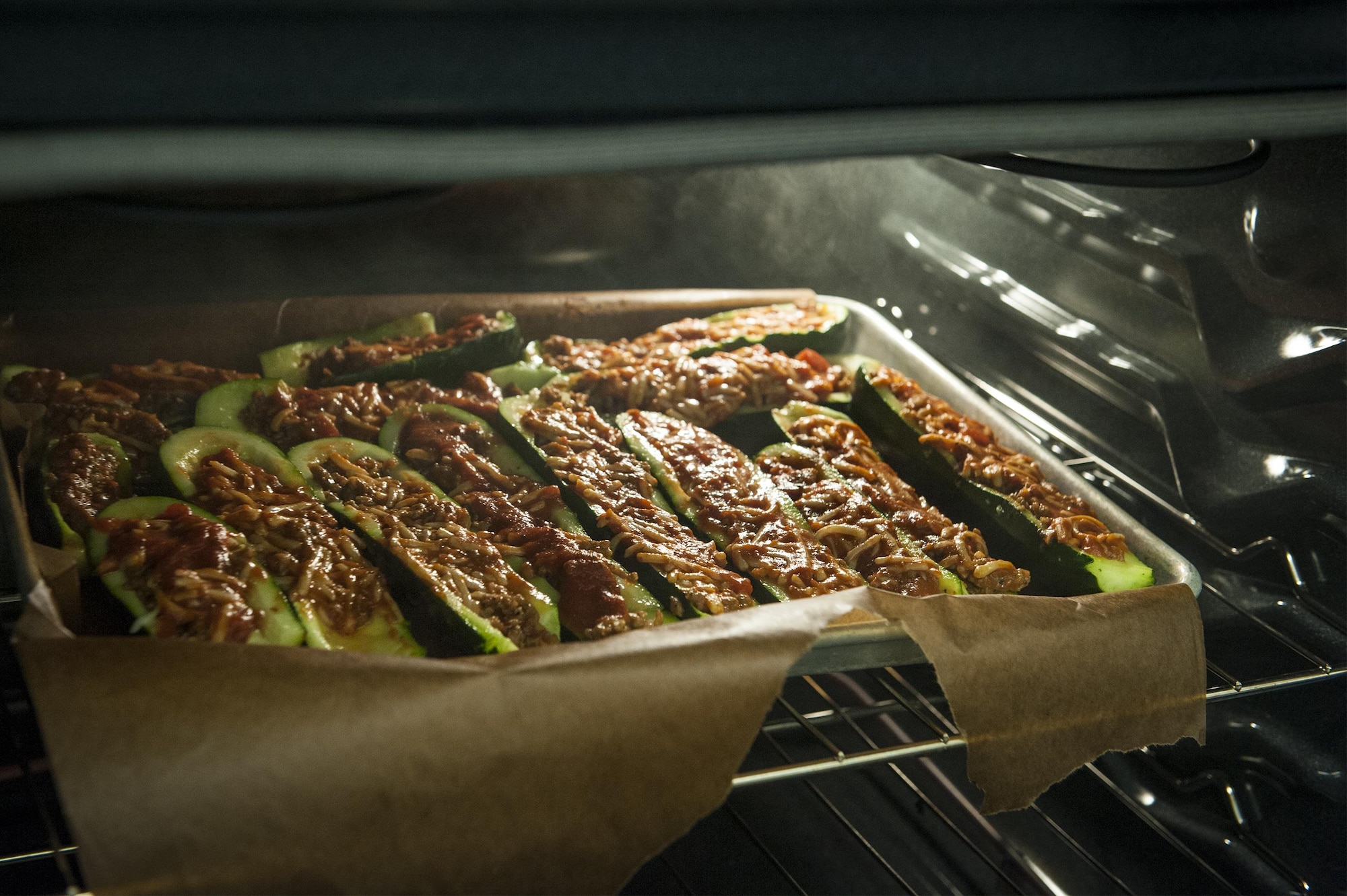 Italian stuffed zucchini cooks in an oven during a youth cooking camp, July 26, 2016, at Moody Air Force Base, Ga. Children prepared the meal under adult  supervision and later enjoyed it for lunch. (U.S. Air Force photo by Airman 1st Class Lauren M. Hunter)