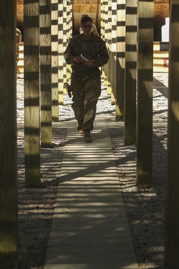 U.S. Marine Corps Cpl. Ashleigh R. McKee, a gunner assigned to the Female Engagement Team, 22nd Marine Expeditionary Unit (MEU), leaves the firing line after a course of fire during a pistol qualification course at Camp Lejeune, N.C., April 26, 2016. Marines with the 22nd MEU participated in a course of fire for pistol qualification in order to improve and maintain combat readiness. 
