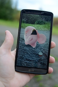 The Pokémon, Clefairy, resists being caught in the augmented-reality game Pokémon Go at Joint Base Elmendorf-Richardson, July 27, 2016.  Pokémon can resist by jumping, smacking the pokéball or running away altogether. Pokémon Go, the most recent Pokémon game, has gained popularity quickly in the past month. (U.S. Air Force photo by Airman 1st Class Christopher R. Morales)